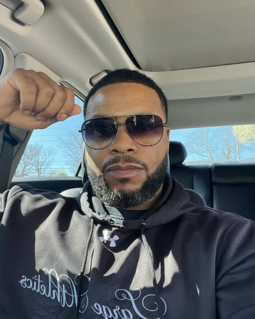 Theron Johnson sitting in car (faith)